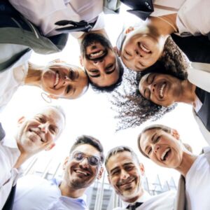 Group of diverse people in a circle looking downwards